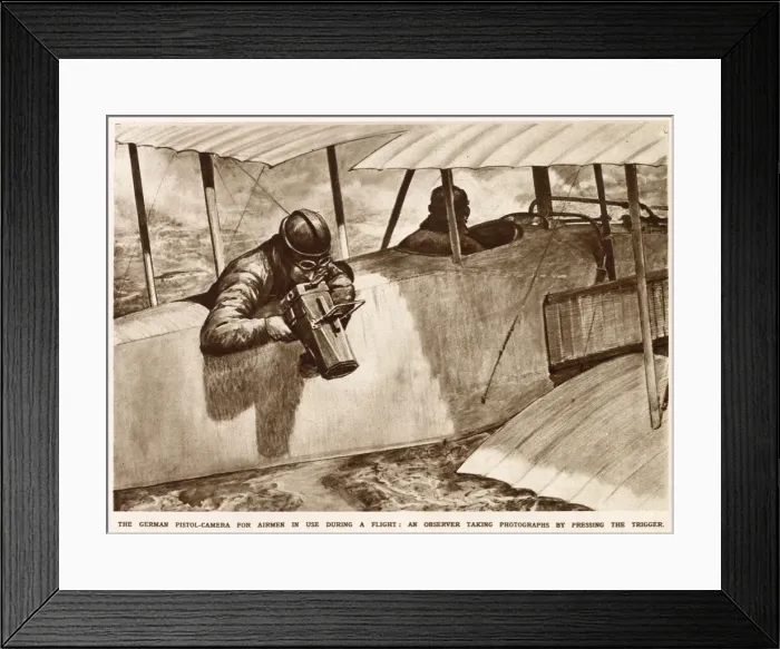 Framed Print : A German observer taking aerial photographs using a pistol-camera over the side of his