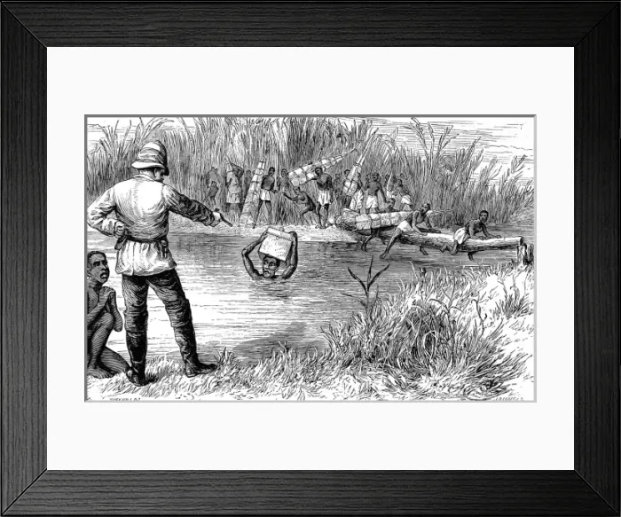 Framed Print : A Member of H. M. Stanleys expedition threatening a baggage Framed Print : A Member of H. M. Stanleys expedition threatening a baggage