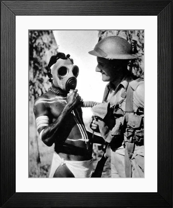 Framed Print : Aborigine trying on a Gas Mask, Australia, Second World War