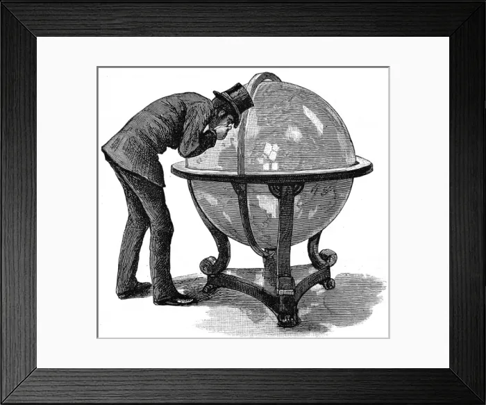 Framed Print : Lloyds Underwriter examining a globe, 1886 Framed Print : Lloyds Underwriter examining a globe, 1886