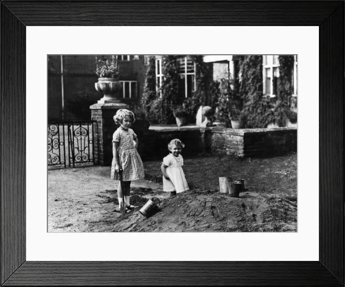 Framed Print : Princess Elizabeth and Princess Margaret digging