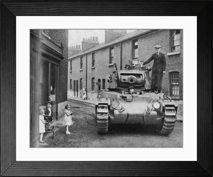 Framed Print : A military tank parked in a residential street Framed Print : A military tank parked in a residential street