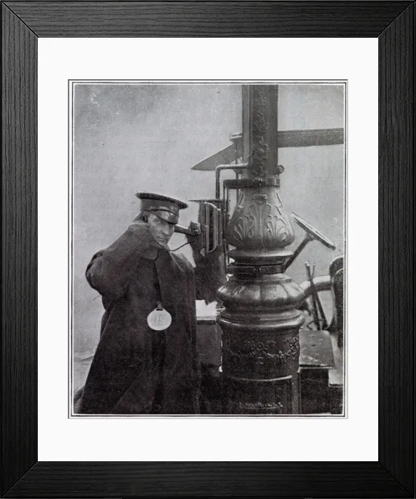 Framed Print : A call-box attached to the electric lighting standard at a cab-rank in Kensington, London
