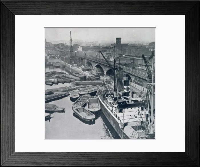 Framed Print : East London and Regents Canal Dock in Limehouse, showing barges waiting for access to Framed Print : East London and Regents Canal Dock in Limehouse, showing barges waiting for access to