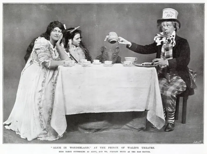 Framed Print : Alice in Wonderland Mad Hatters tea party starring Marie Studholme as Alice and Stanley Brett as the Mad Hatter at The Prince of Wales Theatre, West End, London. Date: 1907 Framed Print : Alice in Wonderland Mad Hatters tea party starring Marie Studholme as Alice and Stanley Brett as the Mad Hatter at The Prince of Wales Theatre, West End, London. Date: 1907