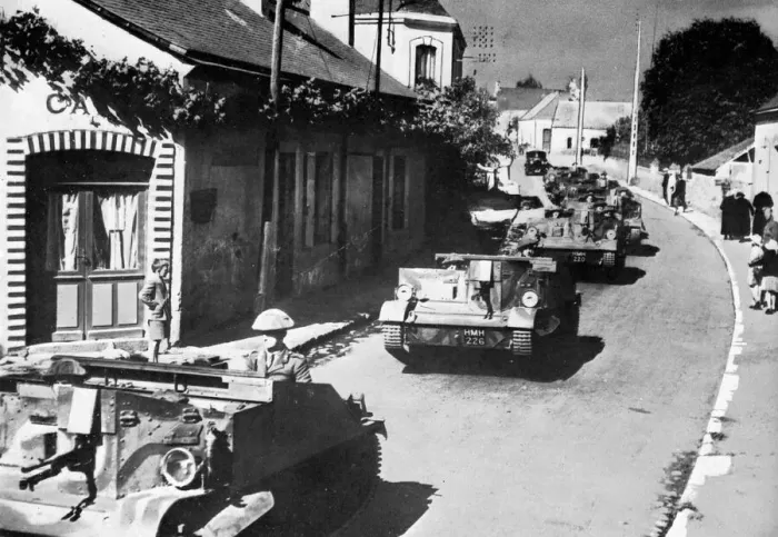 Framed Print : British machine gun carriers passing through French village Framed Print : British machine gun carriers passing through French village
