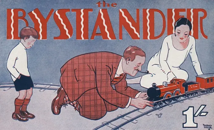 Framed Print : Bystander masthead 1929, playing with train set Framed Print : Bystander masthead 1929, playing with train set