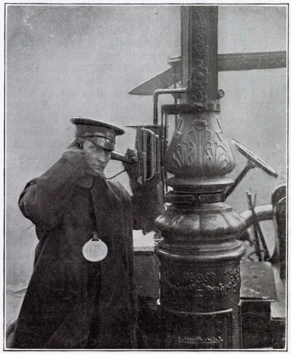 Framed Print : A call-box attached to the electric lighting standard at a cab-rank in Kensington, London