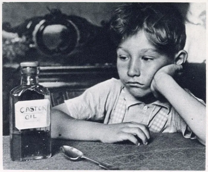 Framed Print : Children were force-fed spoonfuls of castor oil for treatment of constipation. Date: 1939 Framed Print : Children were force-fed spoonfuls of castor oil for treatment of constipation. Date: 1939