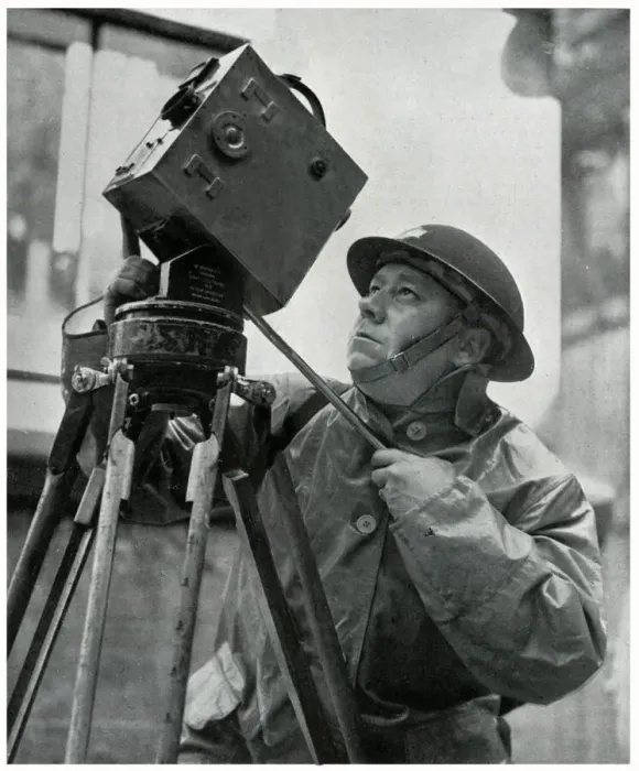 Framed Print : Cinematographer adjusts his camera, September 1939 Framed Print : Cinematographer adjusts his camera, September 1939