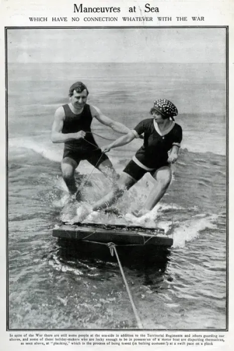 Framed Print : Couple water-planing on a wooden raft