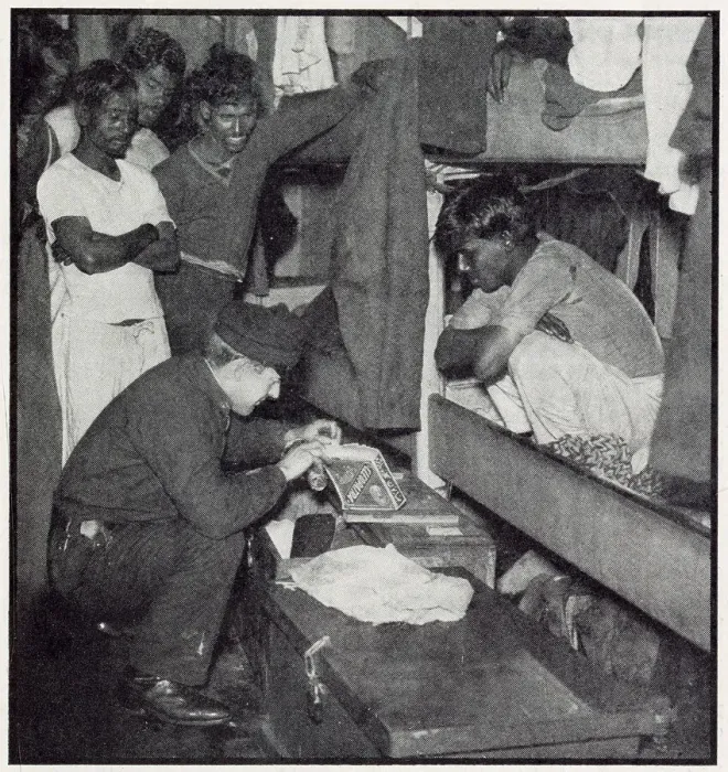 Framed Print : A customs official from the flying squad searches the quarters of a Lascar crew of a sugar freighter to check no dutiable goods have been hidden in odd corners. Date: 1932