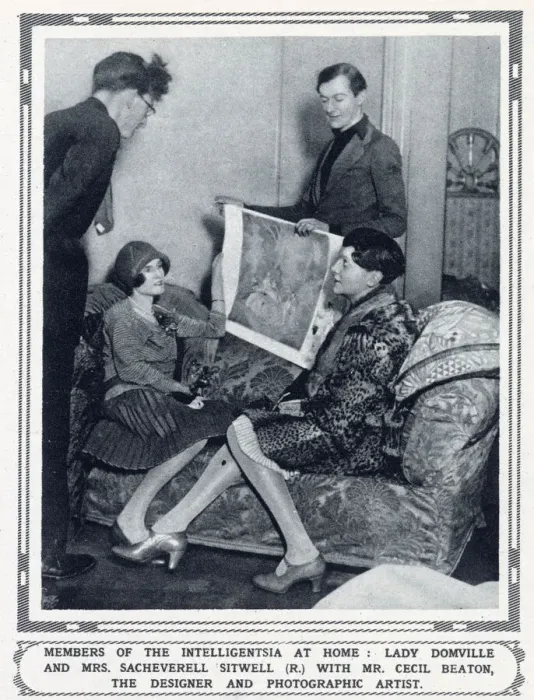 Framed Print : The designer and photographic artist Cecil Beaton (standing - r) showing costume designs to Lady Domville (seated)