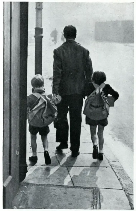 Framed Print : A father leads his two children to be evacuated 1939 Framed Print : A father leads his two children to be evacuated 1939