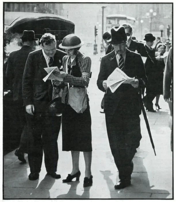 Framed Print : Female and male warden conferring in street, Sept 1939 Framed Print : Female and male warden conferring in street, Sept 1939