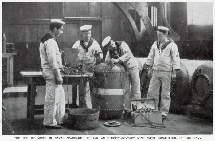 Framed Print : Filling an electro-contact mine with gun-cotton in the Navy. Date: August 1914