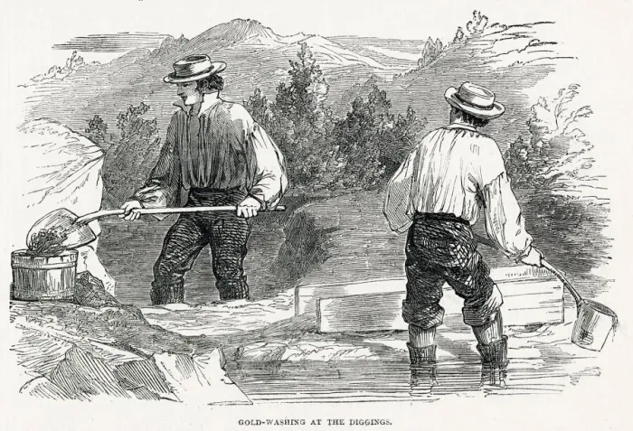 Framed Print : Two fortune seekers, one man shovelling up washed up dirty water into a cradle