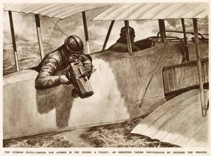 Framed Print : A German observer taking aerial photographs using a pistol-camera over the side of his