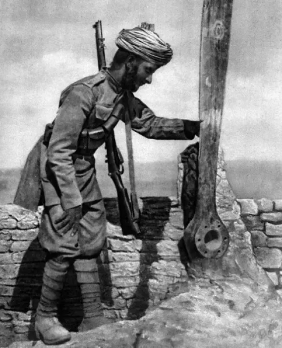 Framed Print : An Indian soldier pays homage to British airmens grave Framed Print : An Indian soldier pays homage to British airmens grave