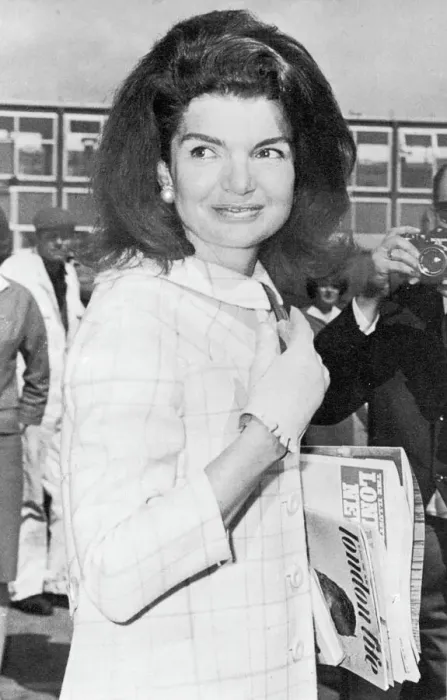 Rights Managed : Jackie Kennedy carrying London Life magazine