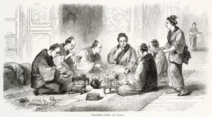 Framed Print : Japanese people sitting on the floor eating their meal using small bowls and chopsticks