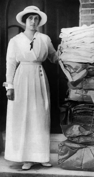 Framed Print : Lady Quilter with pile of comforts for troops, WW1 Framed Print : Lady Quilter with pile of comforts for troops, WW1