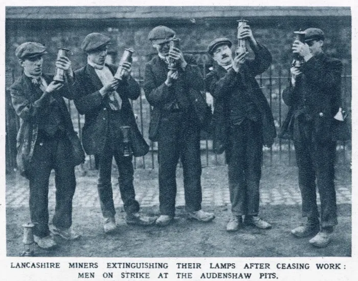 Framed Print : Lancashire miners extinguishing their lamps after ceasing work