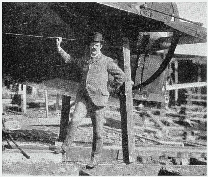 Framed Print : Lewis Nixon (1861 - 1940), naval architect and designer, shipbuilding executive, public servant, and political activist. Photograph showing Nixon standing at the tail end of one of his submarines in the Holland Company's yard. Date: 1902 Framed Print : Lewis Nixon (1861 - 1940), naval architect and designer, shipbuilding executive, public servant, and political activist. Photograph showing Nixon standing at the tail end of one of his submarines in the Holland Company's yard. Date: 1902
