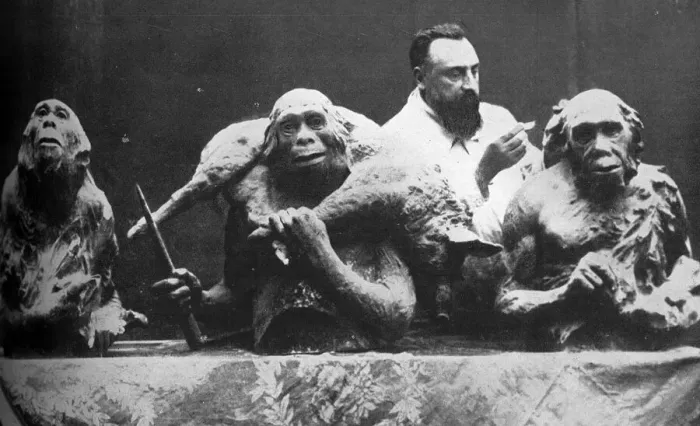 Framed Print : Louis Mascre with sculptures of evolutionary man Framed Print : Louis Mascre with sculptures of evolutionary man