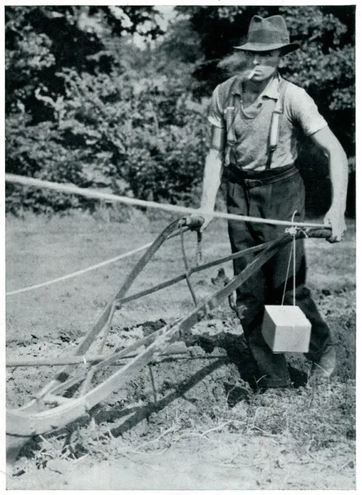 Framed Print : Man ploughing with gas mask, September 1939