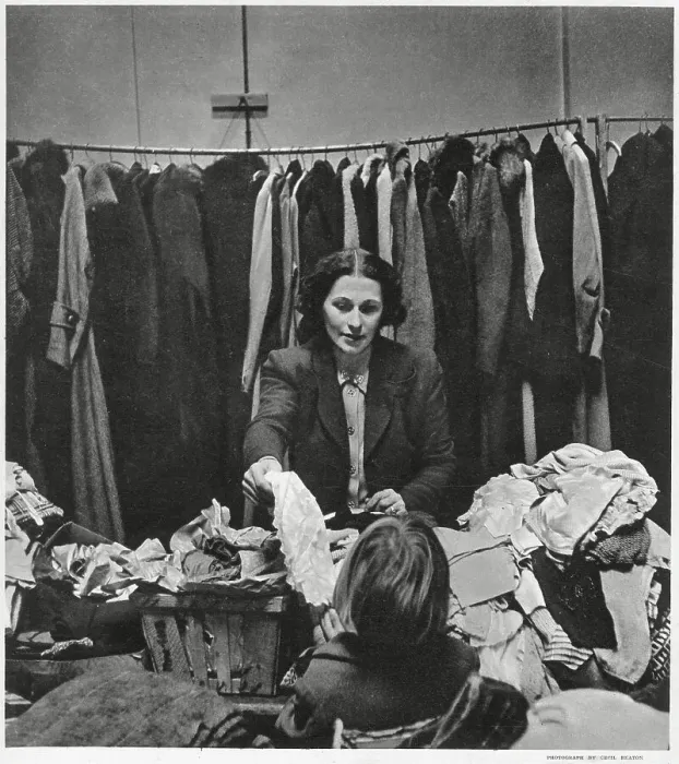 Framed Print : Mrs Robert Hudson wife of Minister of Agriculture and member of the Women's Voluntary Service, in East End, London. Giving out hundreds of articles of clothing and other comforts to homeless people who have lost their belongings Framed Print : Mrs Robert Hudson wife of Minister of Agriculture and member of the Women's Voluntary Service, in East End, London. Giving out hundreds of articles of clothing and other comforts to homeless people who have lost their belongings