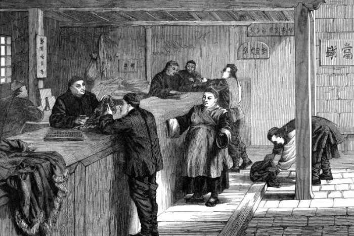 Framed Print : A pawnbroker in Shanghai does business with his customers