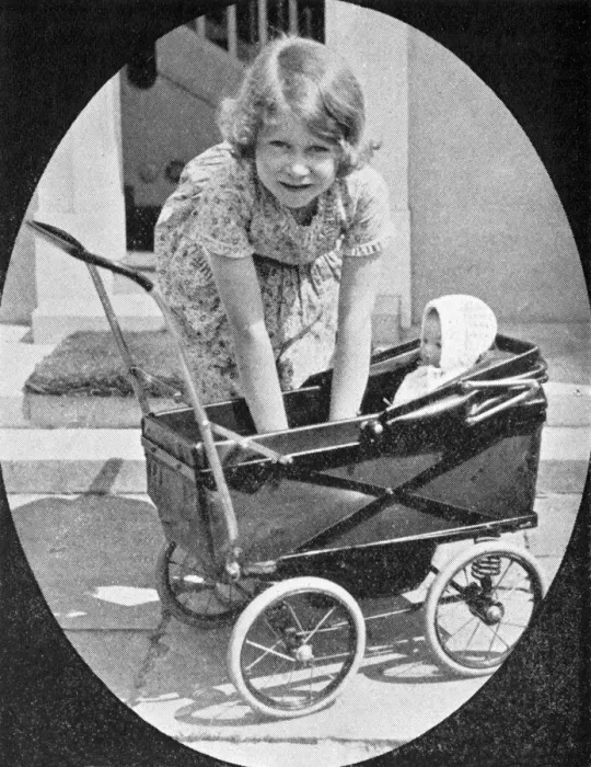 Framed Print : Princess Elizabeth playing with dolls pram Framed Print : Princess Elizabeth playing with dolls pram
