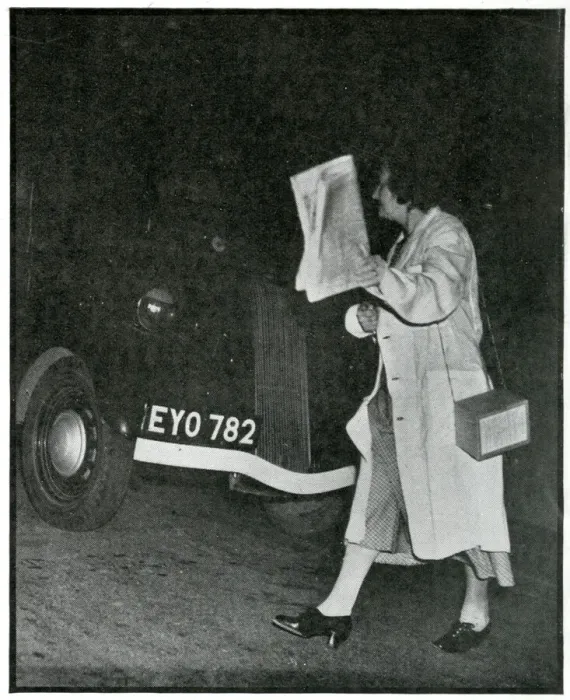 Framed Print : Woman crossing road in the dark in white coat, Sept 1939 Framed Print : Woman crossing road in the dark in white coat, Sept 1939
