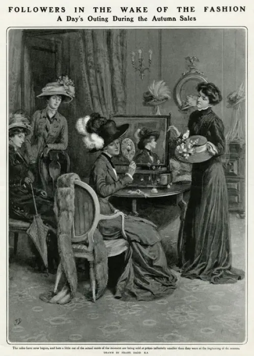 Framed Print : Woman trying on an array of hats in the Autumn sale 1909 Framed Print : Woman trying on an array of hats in the Autumn sale 1909