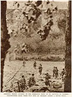 June Prints: American airborne troops advancing through an orchard to the town of St