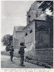 June Prints: American paratroop, hunting snipers in St. Mere Eglise, firing a volley into a church