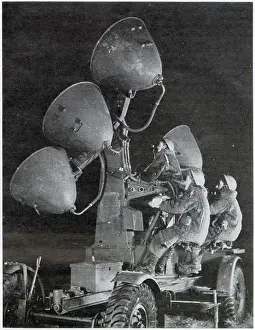 Aircraft Prints: Auxiliary Territorial Service using search lights at night to spot on coming aircraft