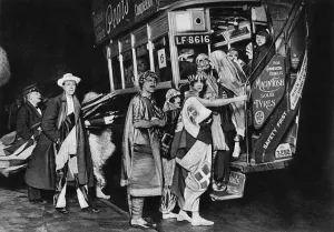 Cast Prints: Cast of Chu Chin Chow catch bus to Night of the Stage Ball