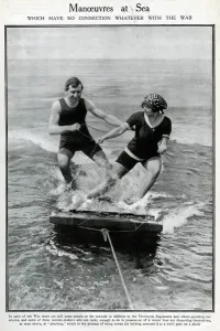 Swimsuit Prints: Couple water-planing on a wooden raft