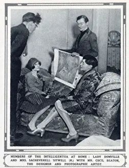 Winter Prints: The designer and photographic artist Cecil Beaton (standing - r) showing costume designs to Lady Domville (seated)