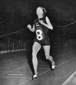 1955 Prints: Diane Leather winning the mile race