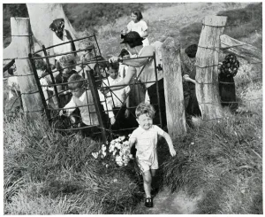 West Prints: Evacuee children walking through countryside gate, Sept 1939