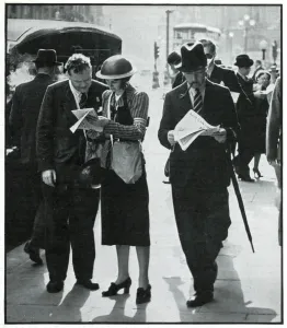 Steel Prints: Female and male warden conferring in street, Sept 1939