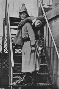 Rescue Prints: Firewomen, a rescue on an iron staircase, WW1