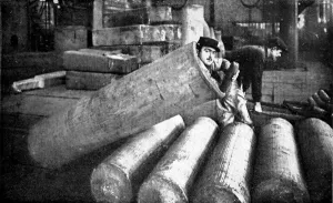 Holding Prints: A French soldier lying inside an artillery shell case