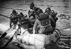 Paddling Prints: Frogmen in their dinghy, 1945