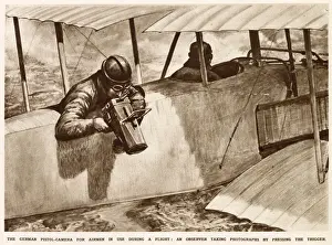 Aeroplane Prints: A German observer taking aerial photographs using a pistol-camera over the side of his