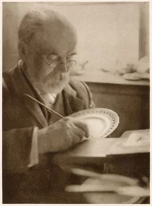 Works Prints: The gilder at work: gilding the edge of the plates. Date: 1913
