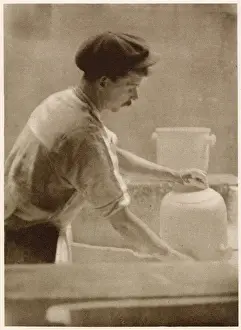 Room Prints: Glazing ware: a dipper at work in the dipping room. Date: 1913